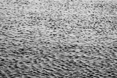 lake with ripples. black and white water surface texture. High quality photoの写真素材