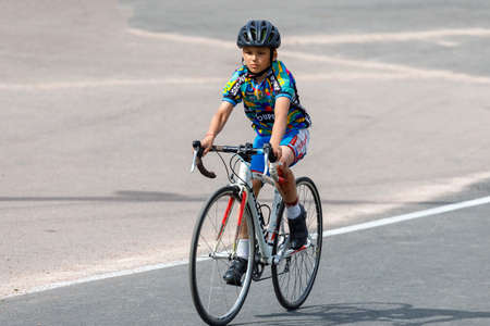 Russia. Vyborg 06.06.2021 boy rides sports bike through stadium in summerのeditorial素材