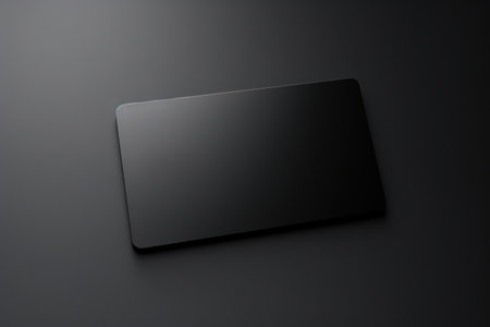 A black laptop computer sitting on top of a table. This picture can be used to represent technology, work, or productivity.の素材