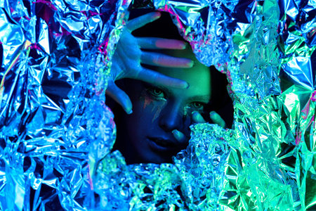 avatar girl closes her eyes with her hands leaving eyes looking at the camera