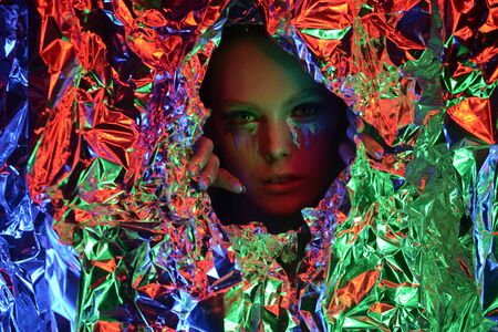Fashion brunette Girl. Beauty Portrait Woman. White Short Hair. Isolated on blinking Christmas Background. Face Close-up. Manicured nails. Vogue Style.の写真素材