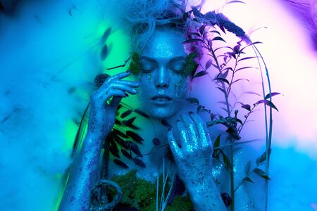beautiful in a fantasy image Body art model lies in ad cor fogの写真素材