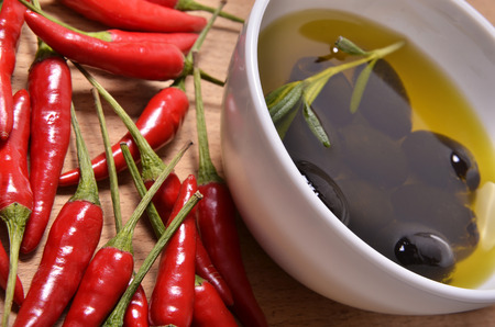 black olives and chili peppersの写真素材