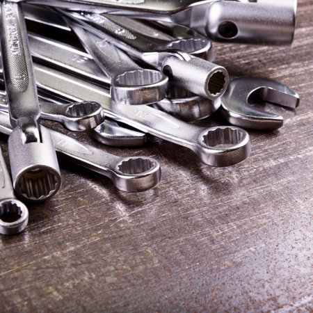 wrenches on a metal background