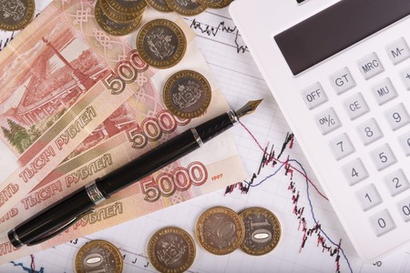 Business concept with calculator, money and documentsの写真素材