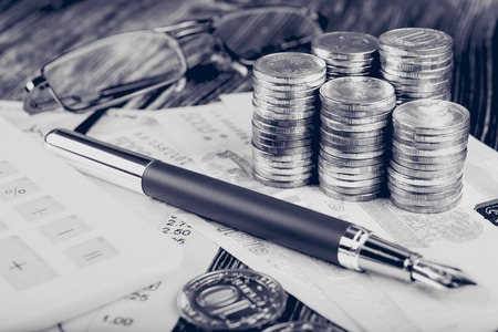 Business concept with calculator, money and documentsの写真素材