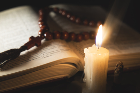 candle with incense and holy bookの写真素材