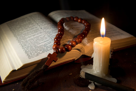 holy book and cross on a wooden background