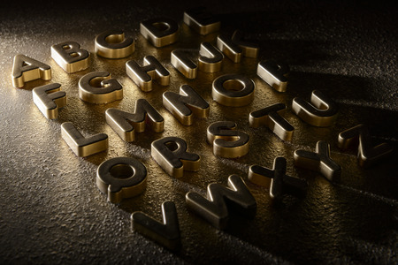 English alphabet on a gold backgroundの写真素材