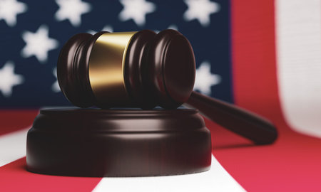 Close-up of a judge's hammer on the background of the American flag.Soft focus.3D rendering.の写真素材