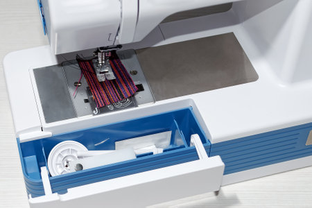 Sewing machine.Built-in compartment for tools and spare parts.Close-up.の写真素材