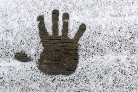 Handprint on the snowの写真素材