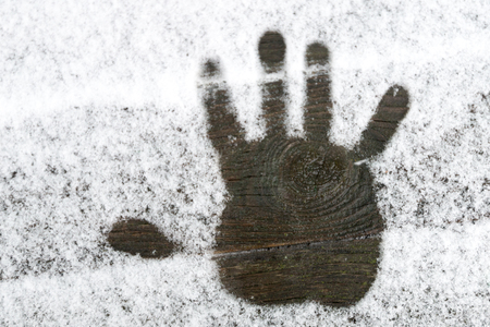 Handprint on the snowの写真素材