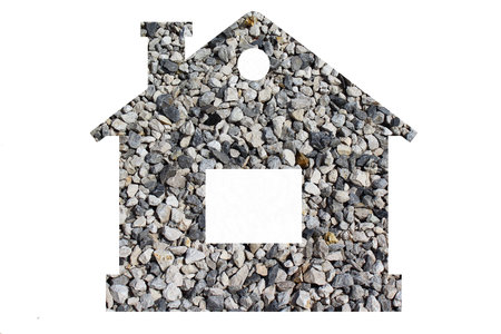 Small stone texture for background. Gray gravel stones for the construction industry. Shot through the cut-out silhouette of the houseの写真素材