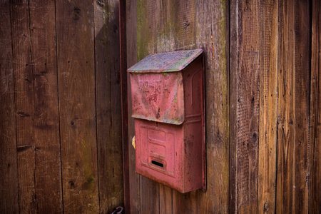 old wooden fence with vintage mailbox