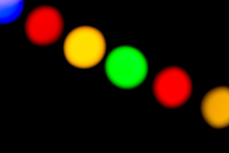 garland of multicolored light bulbs in defocusの写真素材