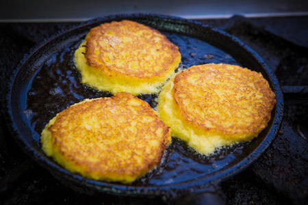 Potato Pancakes. Vegetable fritters. Latkes in frying panの写真素材