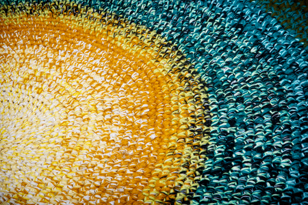 Knitted rustic rug of bright multi-colored woolen stripsの写真素材