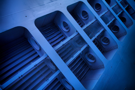 Pipes under the bridge. Metal pipeline under steel bridge. Industrial backgroundの写真素材