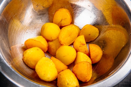 Croquettes frying in the oil, in action. Korokke, japanese food. Potato ballsの写真素材