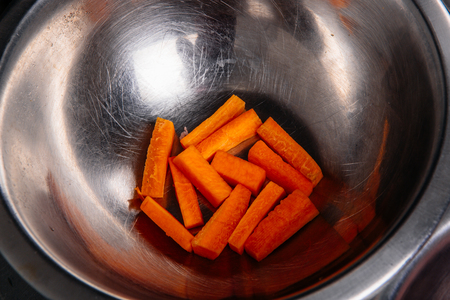Pumpkin vegetable cube slice isolated on whiteの写真素材