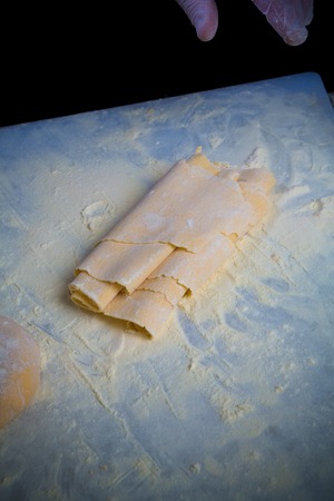 Closeup of process of making cooking homemade pasta. Chef make fresh italian traditional pastaの写真素材