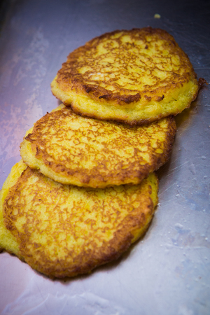Potato Pancakes. Vegetable fritters. Latkes in frying panの写真素材