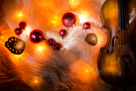 New Year composition with an old violin in dark colorsの写真素材