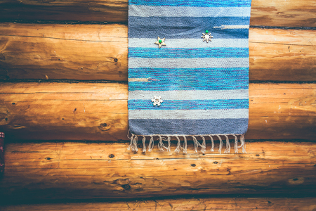 blue homespun rug on the log wallの写真素材
