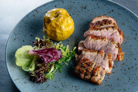 Roast duck with caramelized applesの写真素材