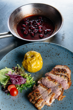 Roast duck with caramelized applesの写真素材