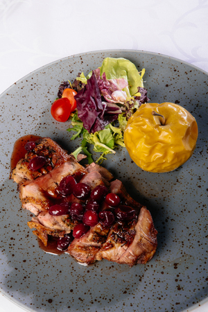 Roast duck with caramelized applesの写真素材