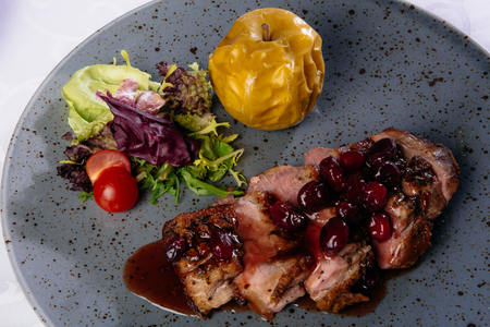 Roast duck with caramelized applesの写真素材