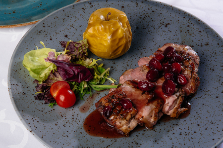Roast duck with caramelized applesの写真素材