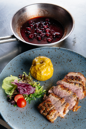 Roast duck with caramelized applesの写真素材