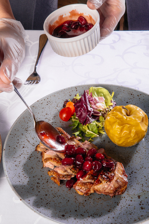 Baked duck with appleの写真素材