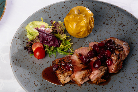 Baked duck with appleの写真素材