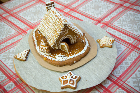 gingerbread houses on a backlit tableの写真素材