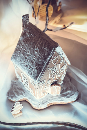 gingerbread houses on a backlit tableの写真素材
