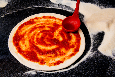 Salami pizza on the tableの写真素材