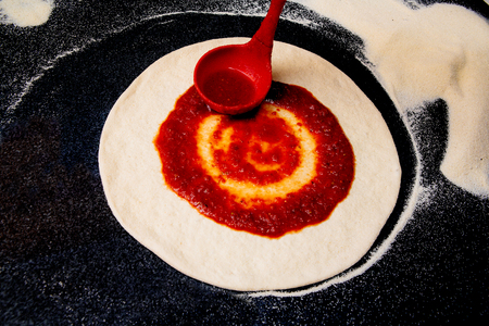 Salami pizza on the tableの写真素材