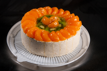 cream fruit cakes with fruits and berriesの写真素材