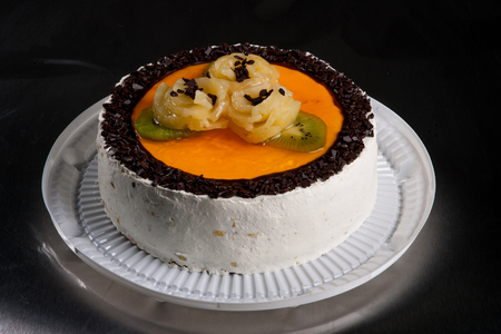 cream fruit cakes with fruits and berriesの写真素材