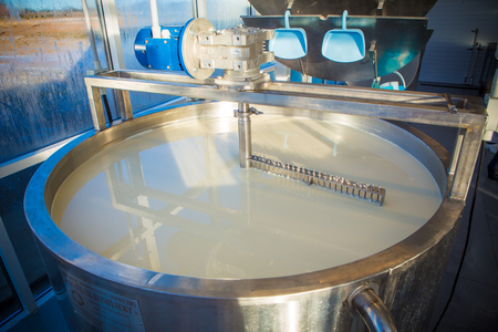 Cheese maker -Traditional cheese making at a creamery,の写真素材