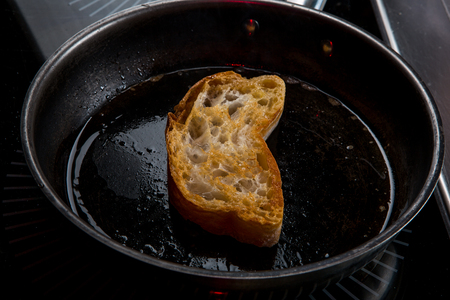 the toast is fried in butter in a panの写真素材