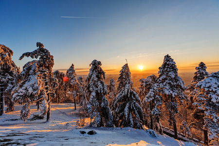 Sunset at mountain with airplain passing byの写真素材