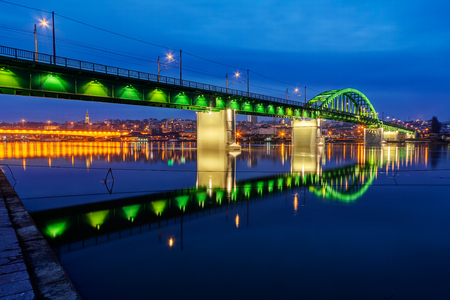 Bridge across river at night with artificial lightning, Belgrade Serbiaの写真素材