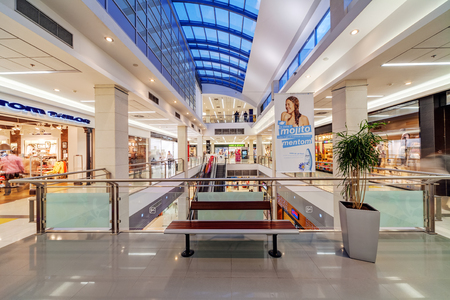 Interior of shopping mall with people walkingのeditorial素材
