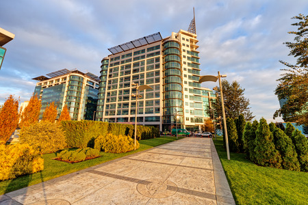 Modern building exterior with glass and metallic facadeの写真素材