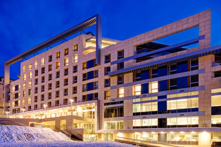 Modern building exterior with glass and metallic facadeの写真素材